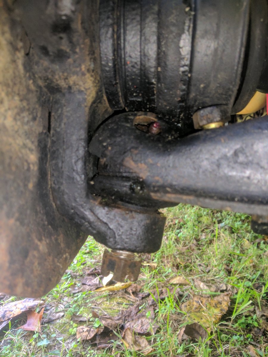 Close-up of the wooden spacer at the upper rebound bumper